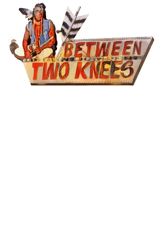Between Two Knees sign