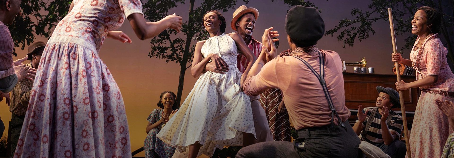 Kimber Elayne Sprawl and J. Quinton Johnson (center) with members of the company in a scene from Zora Neale Hurston’s Spunk. New Songs, Arrangements, and Music Supervision by Nehemiah Luckett; Choreography by nicHi douglas; directed by Tamilla Woodard. Yale Repertory Theatre, October 3-25, 2025. Photo © Joan Marcus.